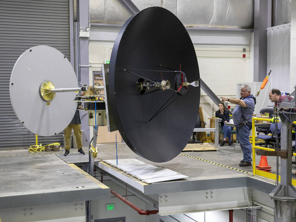 Researchers and test engineers moving the Europa Clipper's High Gain Antenna into Langley's Experimental Test Range.